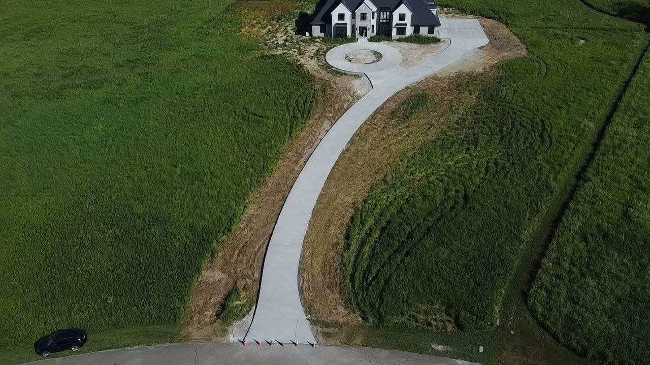 Aerial view of new concrete driveway poured by S&T Concrete