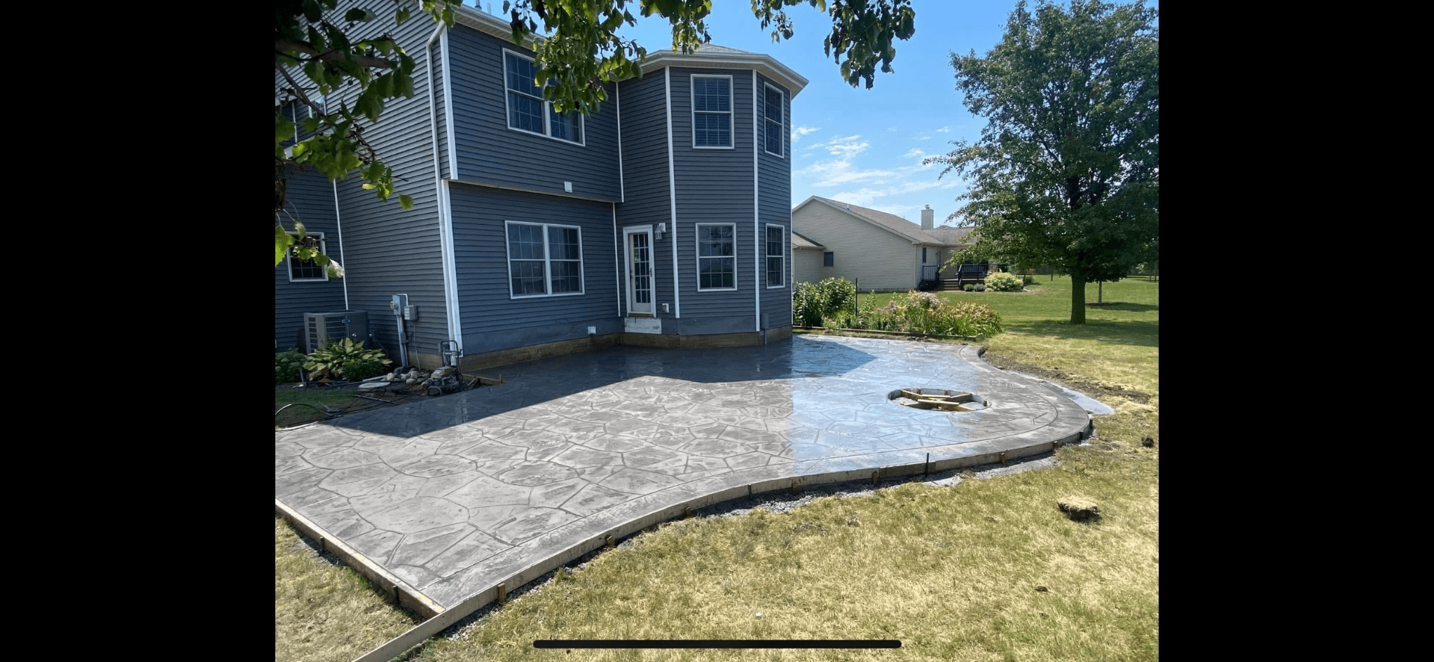 Stamped concrete patio with stone pattern installed by S&T Concrete, central Illinois